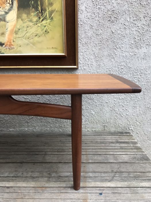 Mid Century 1960s E Gomme G Plan Teak Coffee Table This is a G Plan Long Coffee Table in teak c1968. A beautifully made table in attractive Teak timbers. The table top is veneered in a straight grained red toned teak with all edges finished in solid teak of a darker tone. The sides of the table are straight and the ends are curved, the edge strips widen to the centre of the table to give a tapering form. The top is supported on a solid teak stand with round tapering legs joined by curving rails. Condition, is very good, there are no repairs and no untoward patination. The top has been cleaned and waxed but the vintage condition is still as is. Measurements: H40cm x W137cm x D49cm Free Delivery within Cardiff. Delivery possible within 60 miles of Cardiff - please message for a quote. London / M4 corridor delivery possible please message. Collection preferred from CF11 9BZ - cash on collection. Happy to work a courier of your choosing/ organising.